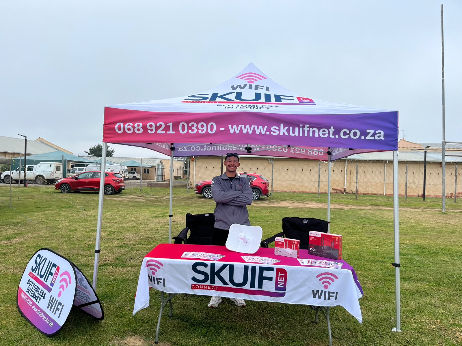 SkuifNet branded gazebo and team member at a local community exhibition