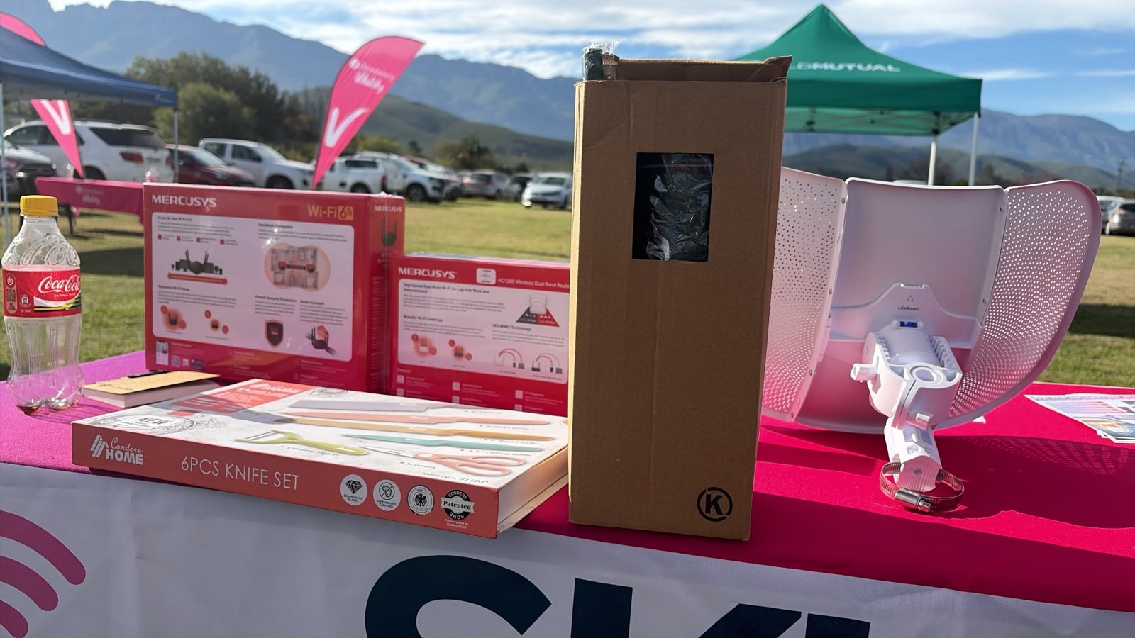 SkuifNet display table with routers and wireless equipment at a local event