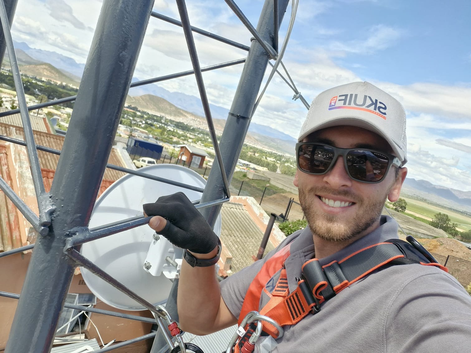 SkuifNet team member Eddie on a tower overlooking the local valley
